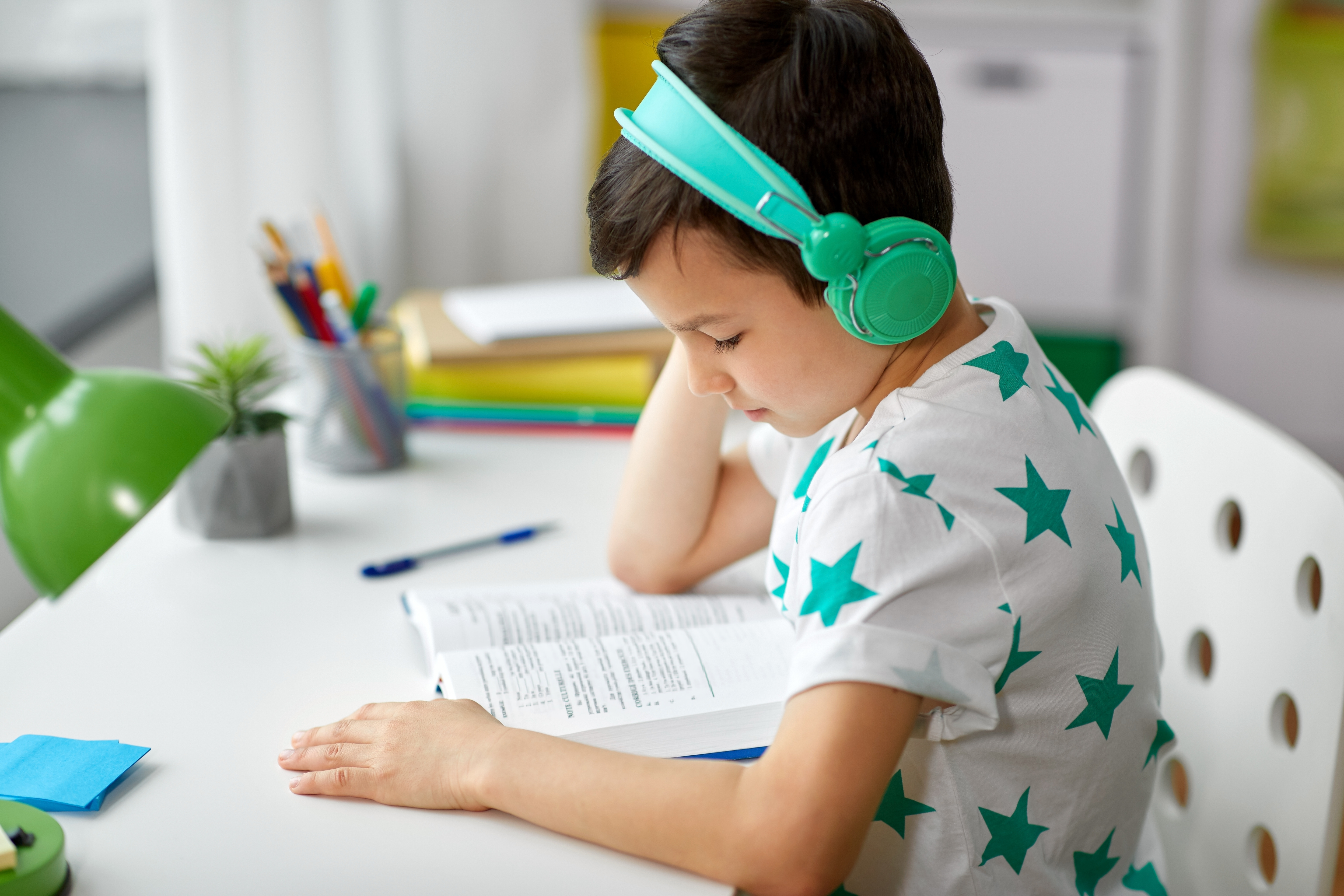 Teenage son listening music in headphones or playing online games ignoring his mother Stock Photo - Alamy