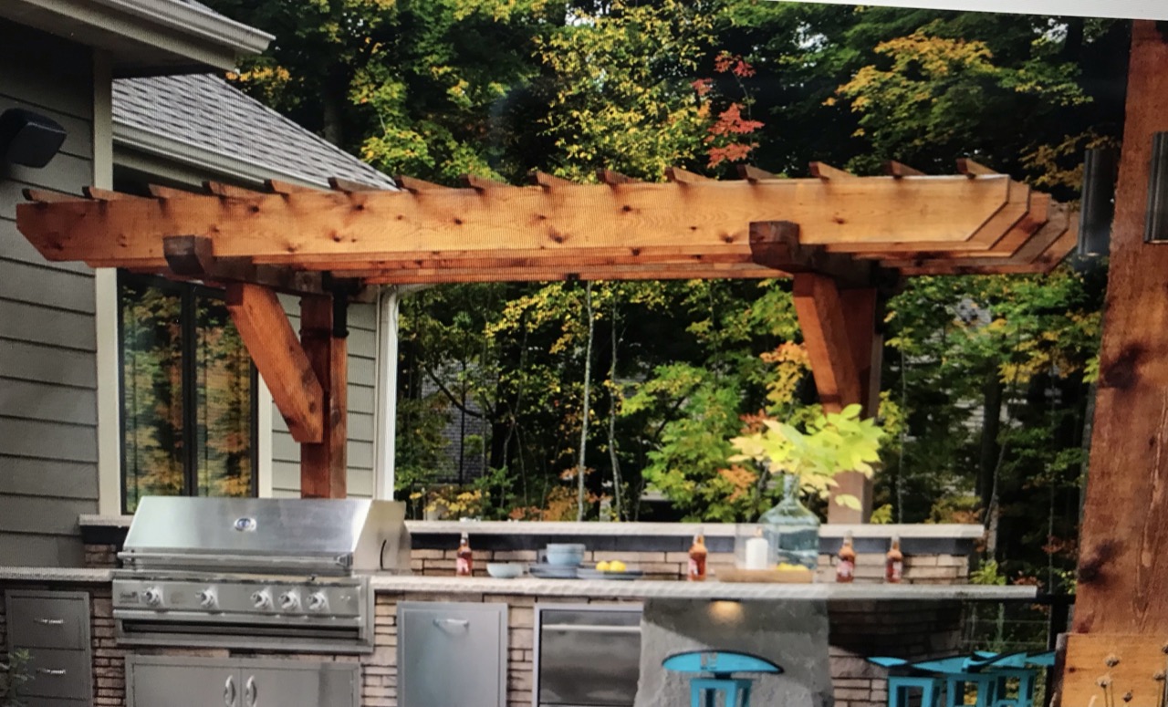 A picture containing outdoor pergola over and outdoor grill/kitchen area