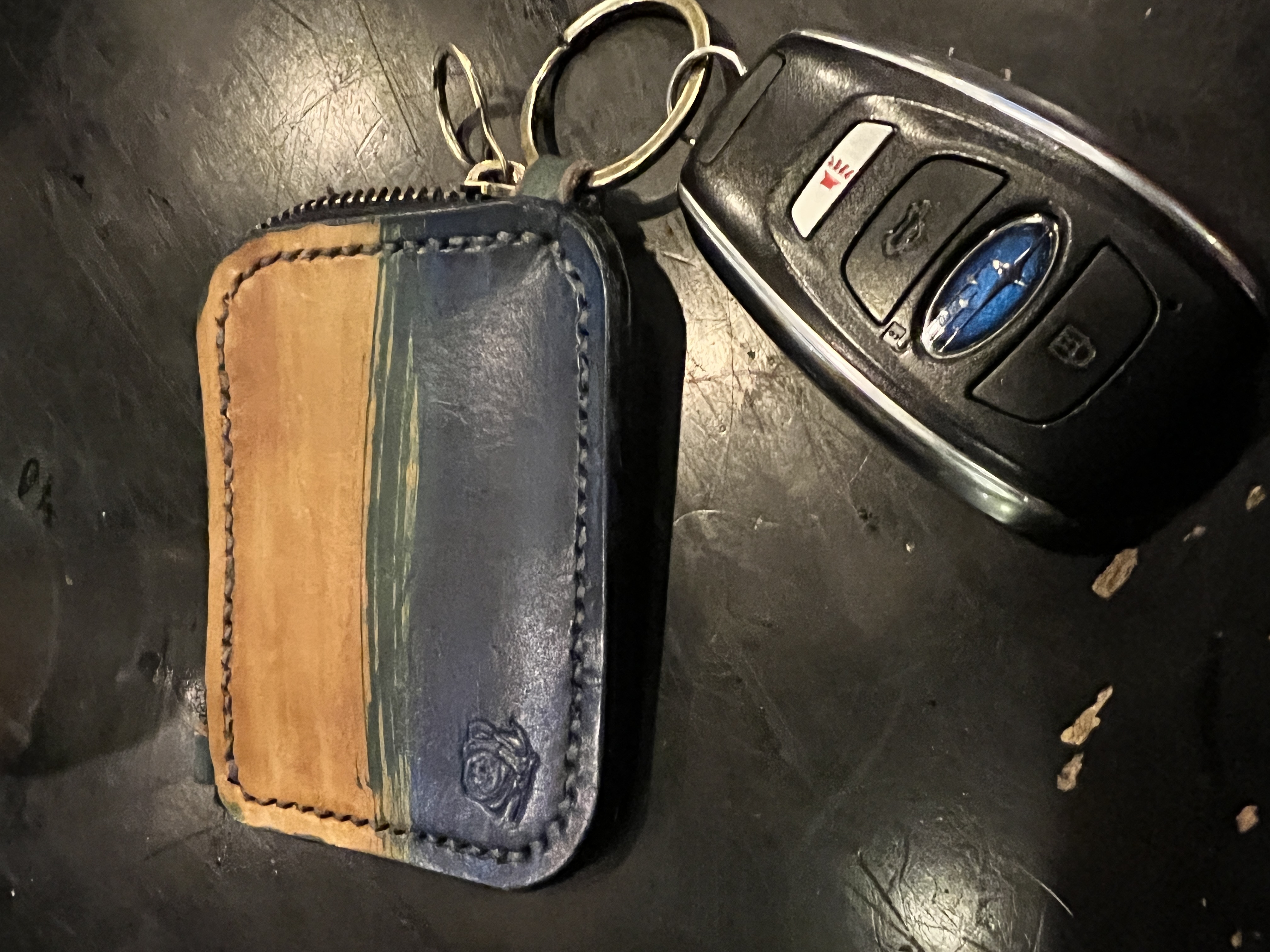 photo of finished leather wallet attached to car key