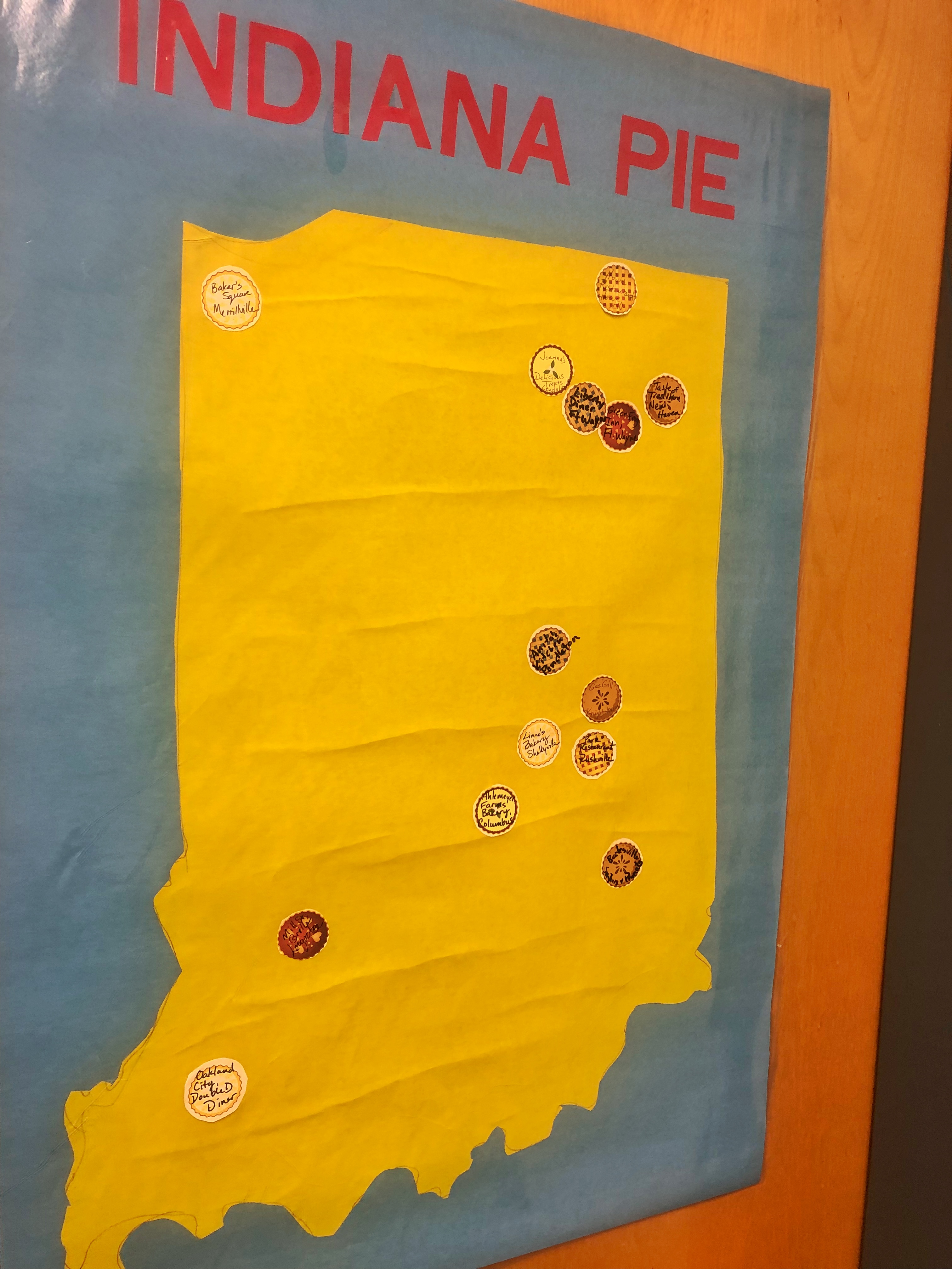 outline map of Indiana with pie stickers placed where Bev has traveled for PATINS and found good pie