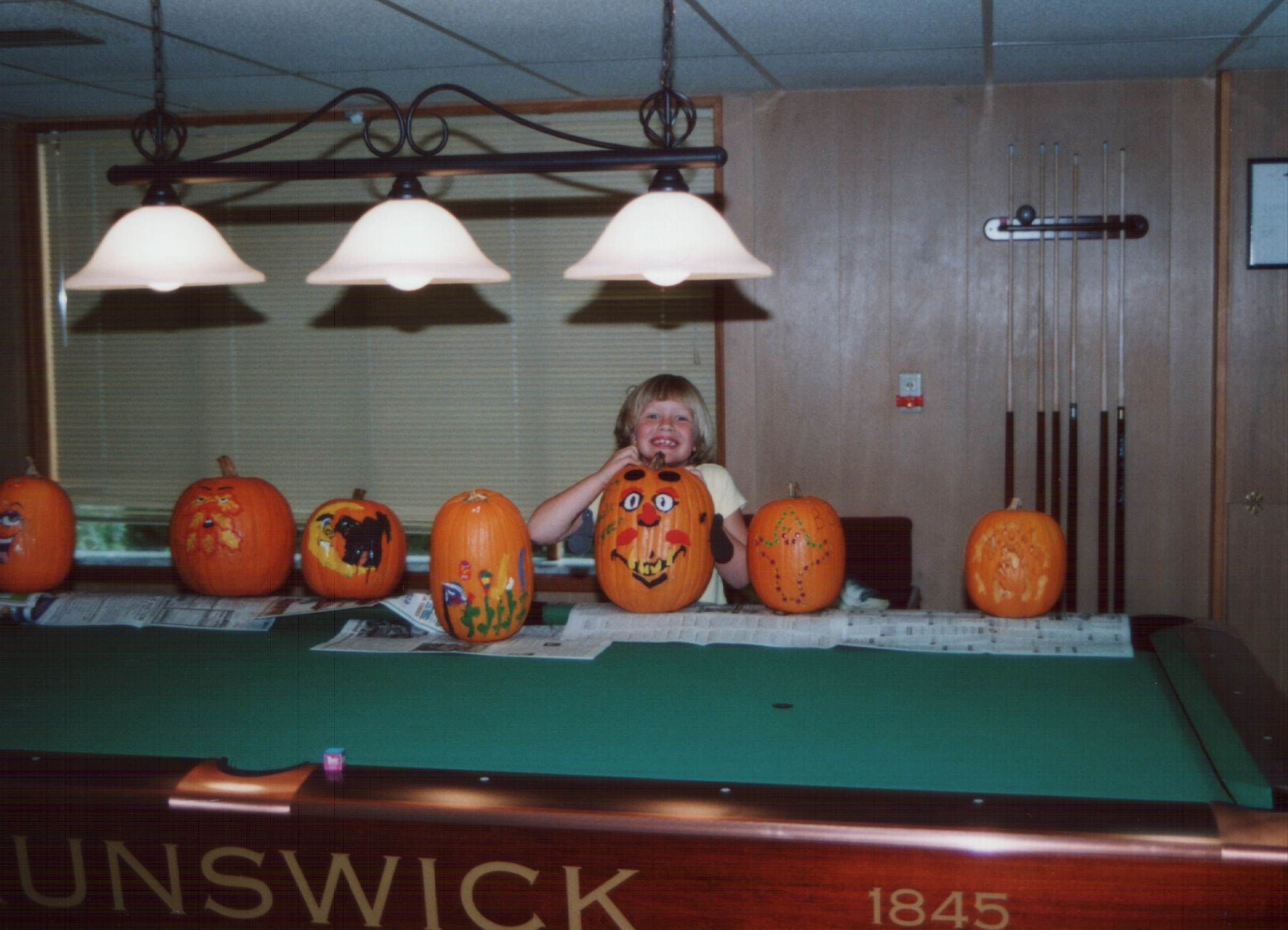 Sandy's daughter Courtney with painted pumpkins