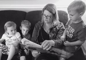 Mimi reading to three of her Grandkids.