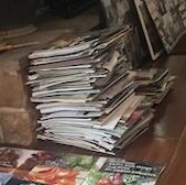 Tall stack of magazines.
